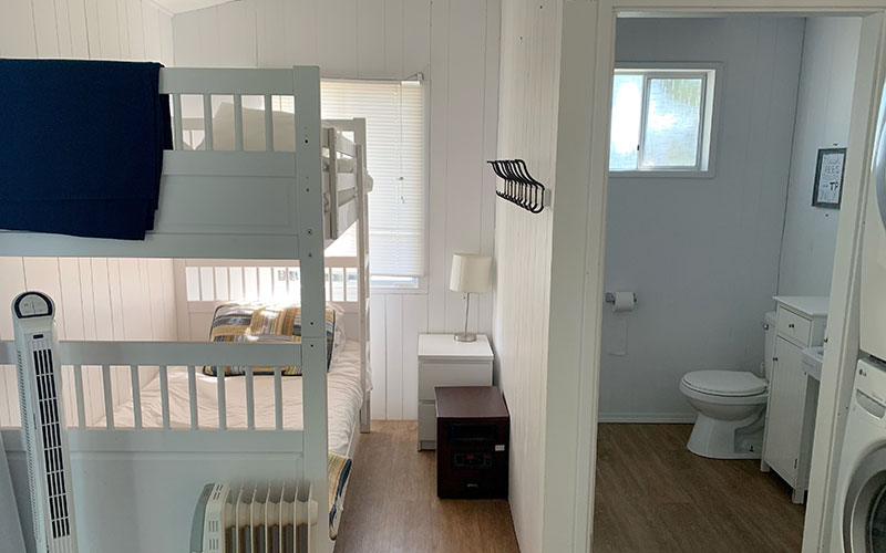 Bunkhouse Our bunkhouse has room for 6 including a queen bed and 2 bunk beds. Plus it inlcudes it's own bathroom and the laundry facilities.